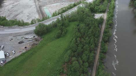 Drone-flies-back-to-reveal-a-quarry-and-a-river-in-the-Midwest-USA