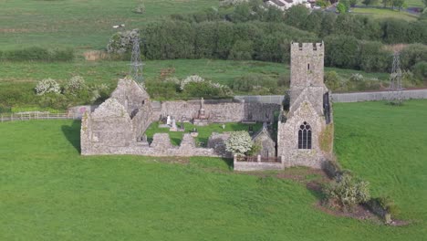 clare abbey ruins, historic augustinian monastery in clarecastle, county clare, ireland. - aerial shot