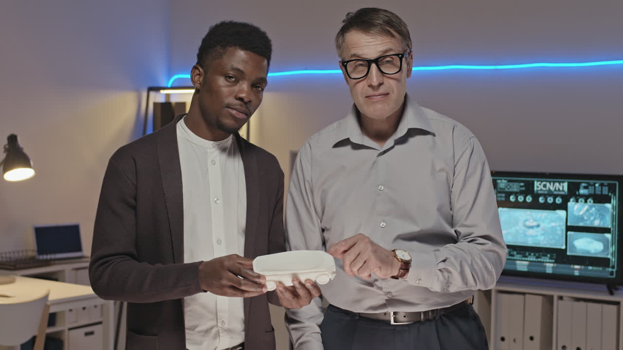 Engineers Discussing 3D Printed Car Model and Posing