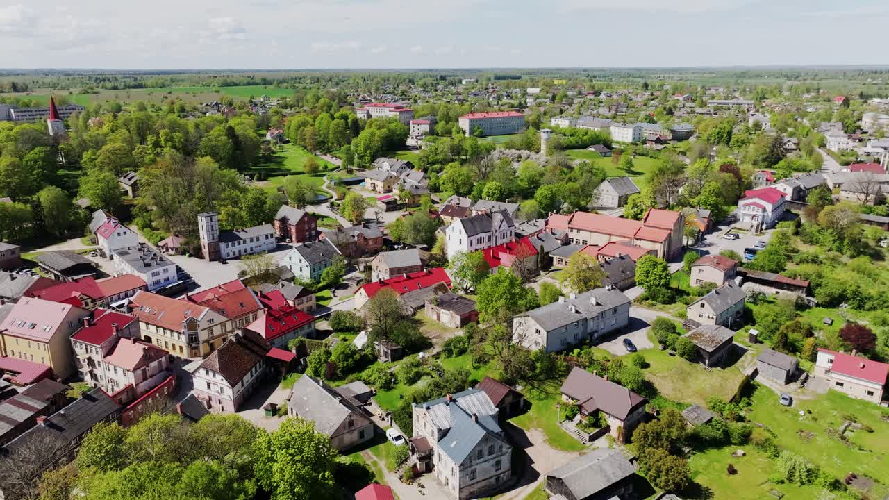 Peaceful spring aerial establishing shot, Kandava Latvia showing old town center