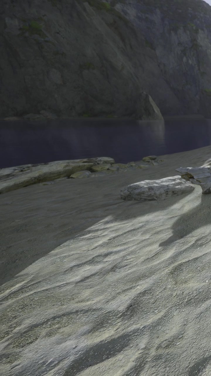 Sand and rocks near a calm water body in scenic outdoor setting