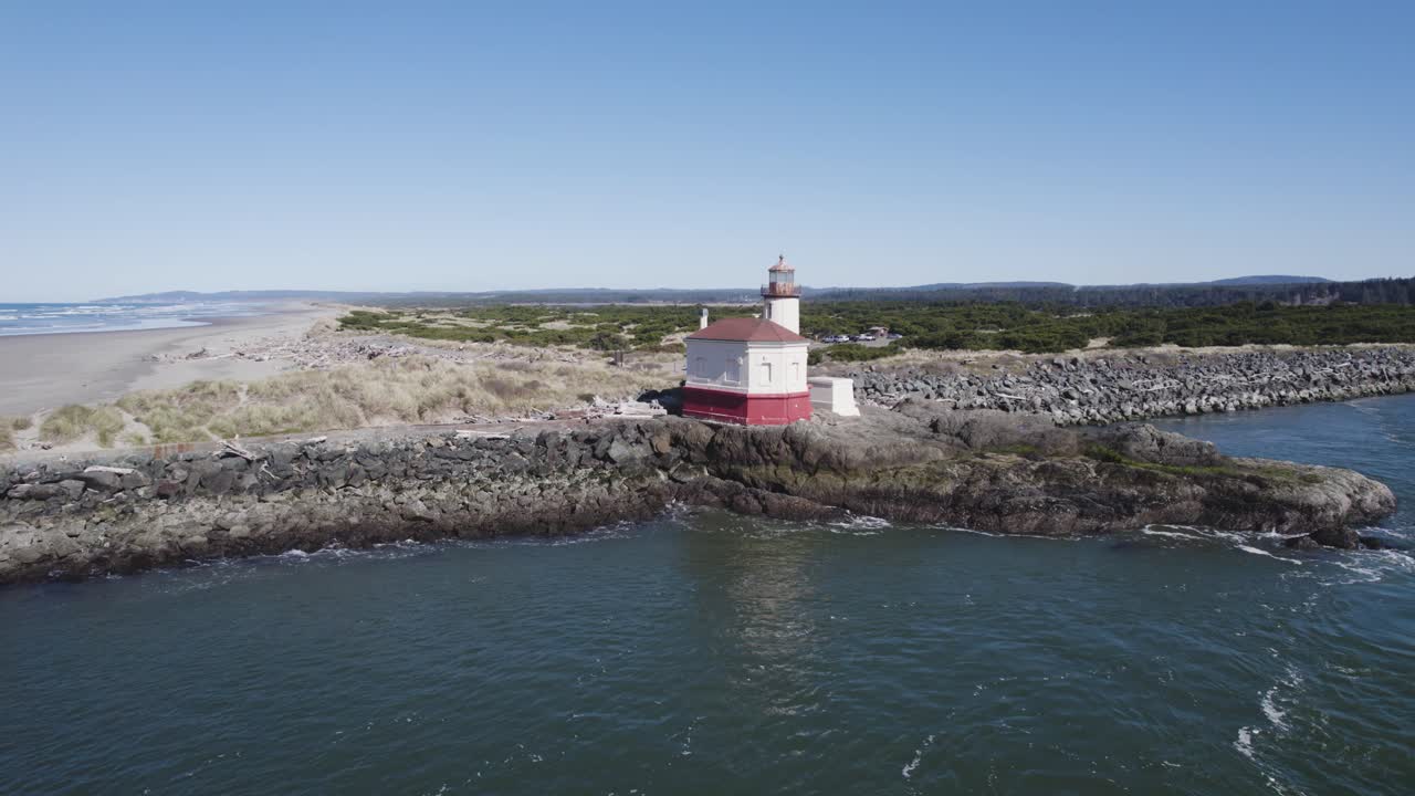 Beautiful 4k aerial pullback of Coquille River Lighthouse on Bandon Oregon coast