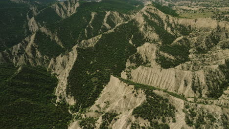 Ragged-hill-terrain-with-forest-groves-in-arid-landscape-of-Georgia