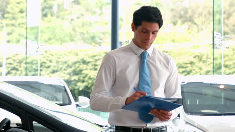 Businessman-checking-out-a-car