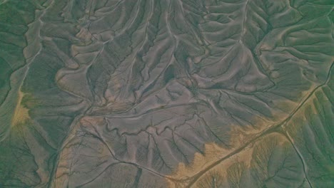 4K drone of Factory Butte, Utah, dramatic desert ridges, sculpted gullies, and layered rock textures. A visually striking landscape perfect for travel, adventure, and nature focused content.