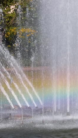 colorful rainbow forms in fountain spray