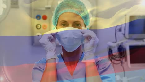 Animation-of-flag-of-colombia-waving-over-surgeons-in-operating-theatre