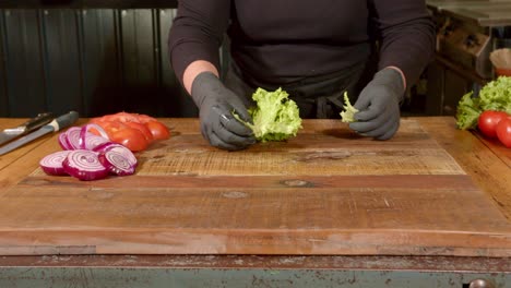 Fresh-colourful-salad-being-prepared-on-a-wooden-chopping-board