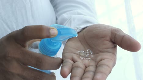 applying hand sanitizer