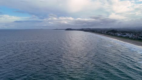 aerial view of ocean and coastline at sunset