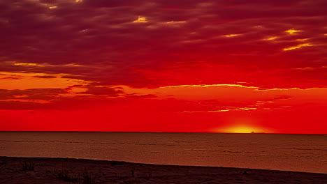 beautiful colorful sunset at sea with dramatic clouds and sun shining