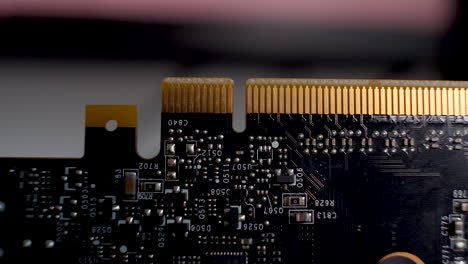 close-up of a graphics card, the pcb with its array of yellow pin connectors which seamlessly integrate with motherboards, embodying the concept of technological synergy and hardware integration