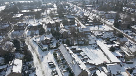 beautiful aerial of suburban neighbourhood covered in snow