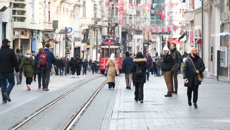 crowded city street with tram in istanbul, turkey