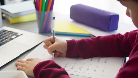 Close-up-of-video-of-boy-practicing-a-math-equation