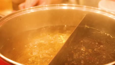 boiling hot pot with two broth sections