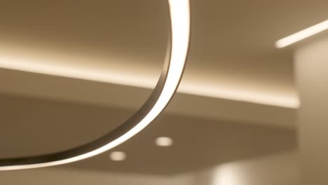 slow orbiting shot of bright circular led lights lighting a villa