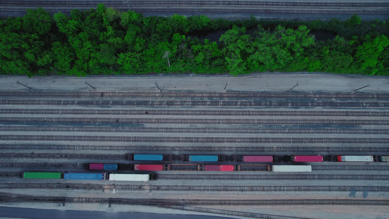 Aerial View of Train Tracks and Trains in a Rail Yard