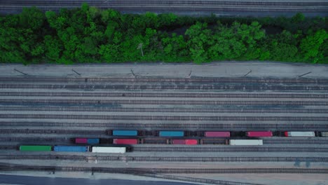 aerial view of train tracks and trains in a rail yard