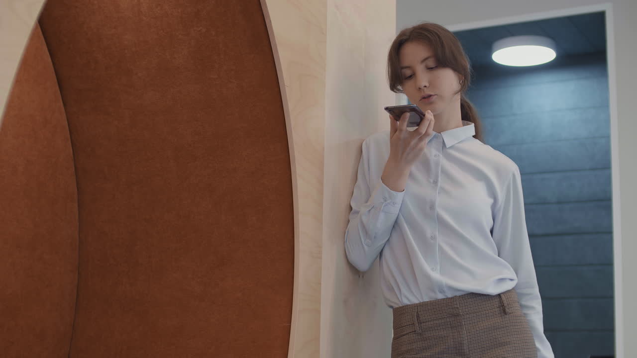 Caucasian Businesswoman Having Phone Talk in Office