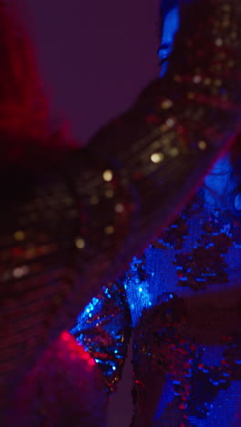 Vertical-Video-Of-Two-Women-In-Nightclub-Bar-Or-Disco-Dancing-With-Sparkling-Lights-In-Background-3