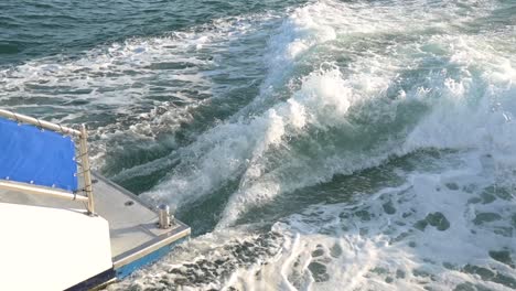 wake from catamaran boat's engine during the day