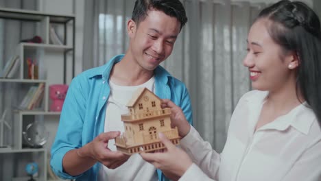 couple looking at a model house