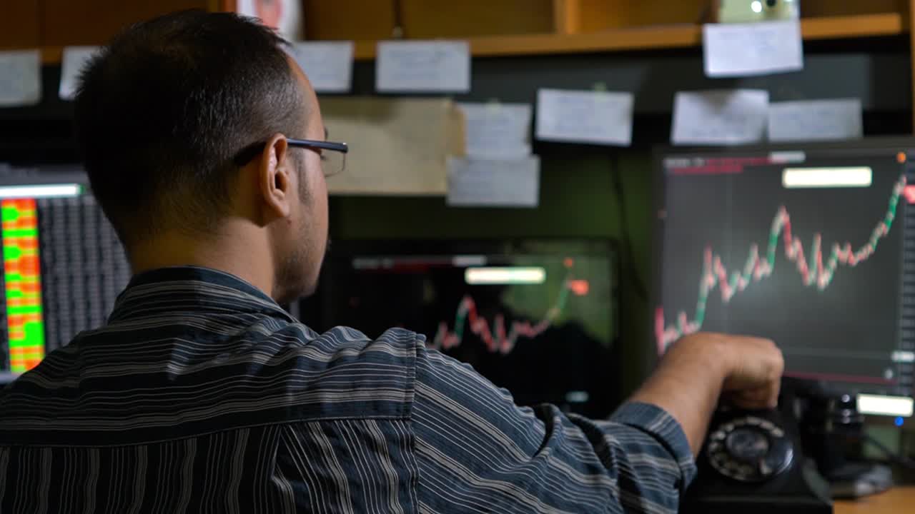 Stock market broker watching stocks