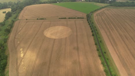 hampshire farmland meadows aerial view heading towards golden disc remains of harvested crop circle