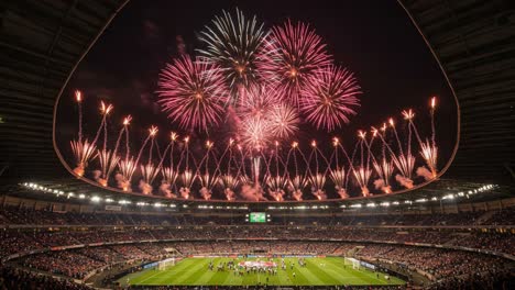a spectacular display of fireworks illuminates the stadium during a grand celebration, capturing the excitement and energy of the event with a thrilling atmosphere