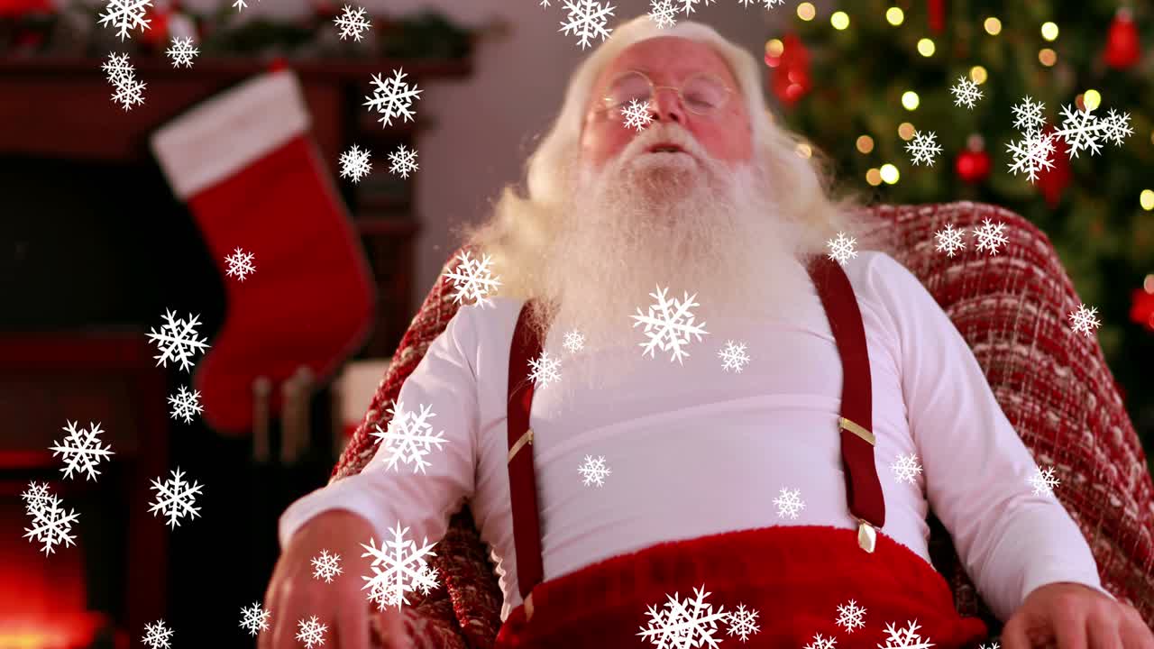 Fiocchi di neve che cadono su Babbo Natale che dorme su una sedia.