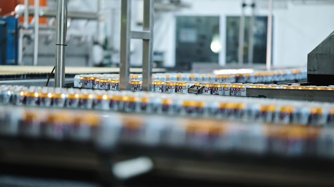 Soda cans in a factory production line