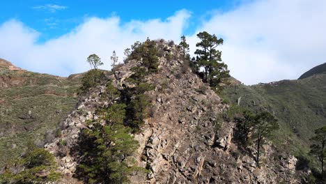 Upwards-Revealing-Aerial-Shot-of-Peak-of-Mountain-in-Macizo-de-Anaga-Mountain-Range