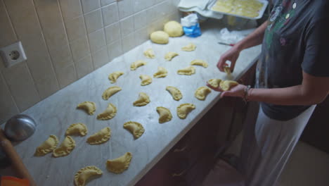 CLOSEUP-footage-of-a-woman-preparing-home-made-greek-cheese-pies