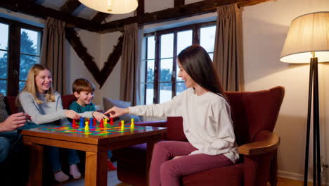 family playing board game at home