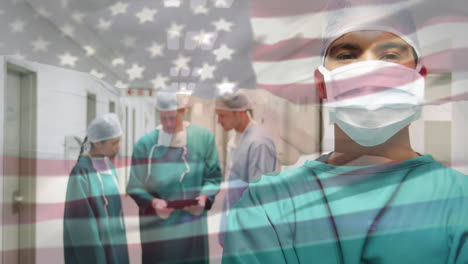 Animation-of-flag-of-usa-waving-over-surgeons-in-operating-theatre