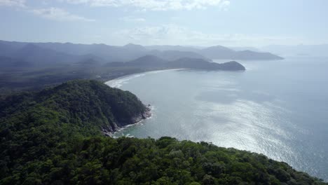 flying over green, seaside mountains in sunny costa verde, brazil - aerial view