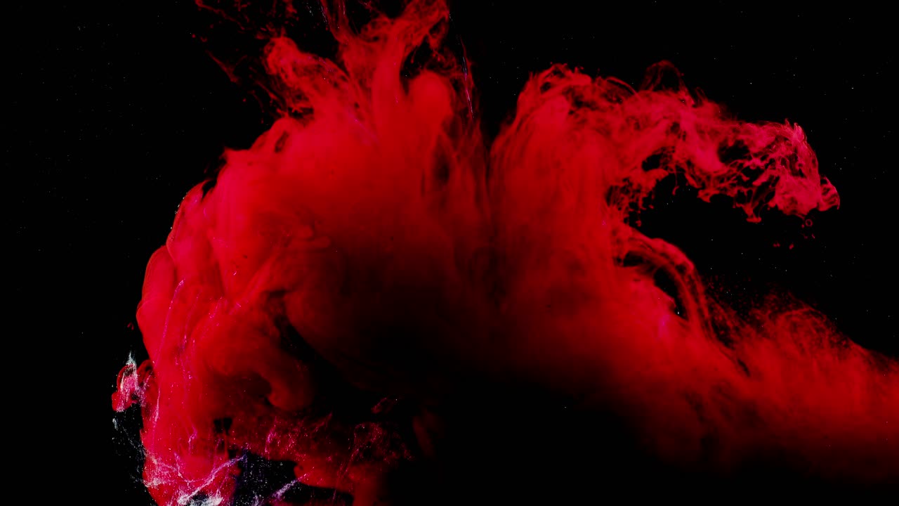 Abstract forms. Shooting on a black background. Mixing of paints