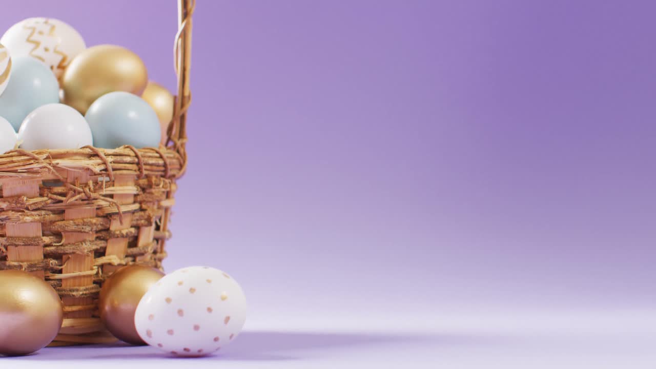 Basket with colorful easter eggs on purple background with copy space