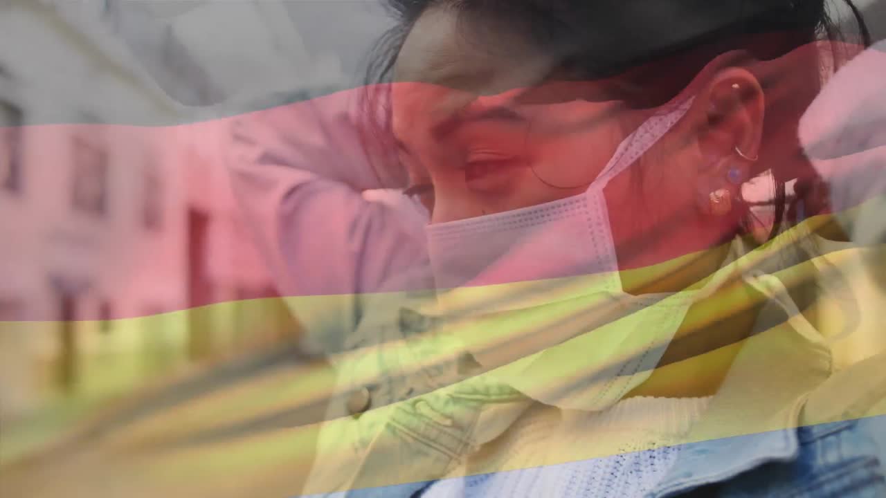animación de agitar la bandera de alemania contra una mujer asiática con máscara facial en la calle