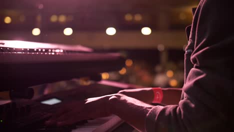 pianist playing piano at a theater in slowmotion