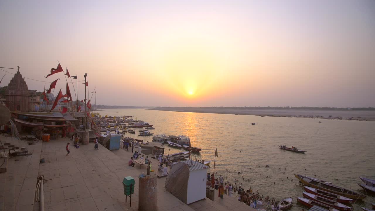 Shot of Flags by the Ganges at Sunset