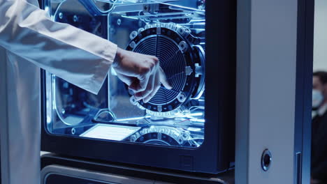scientist working on advanced laboratory equipment