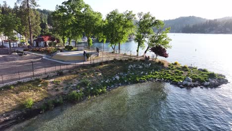 lake arrowhead village california dramatic sunset reflecting on the water aerial static