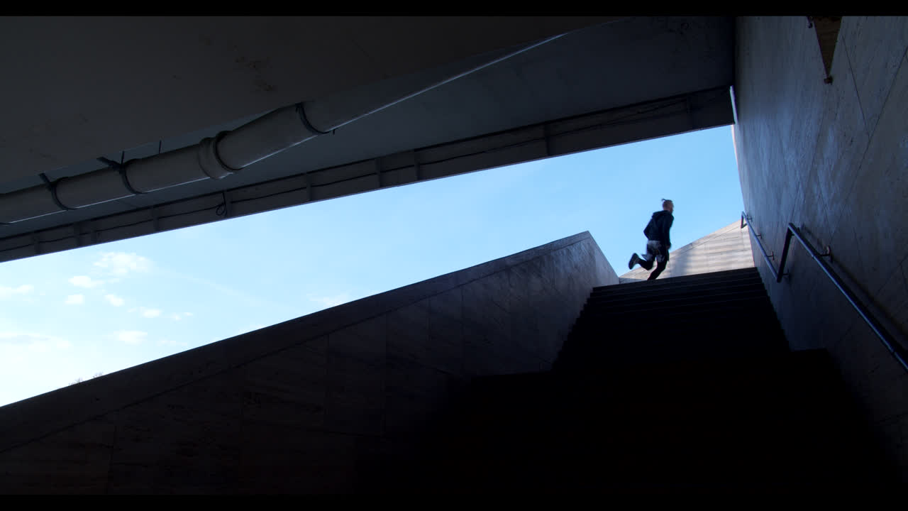 Person Running Up Stairs in Urban Setting