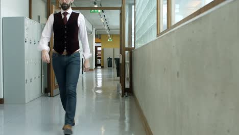 male executive walking in corridor 4k