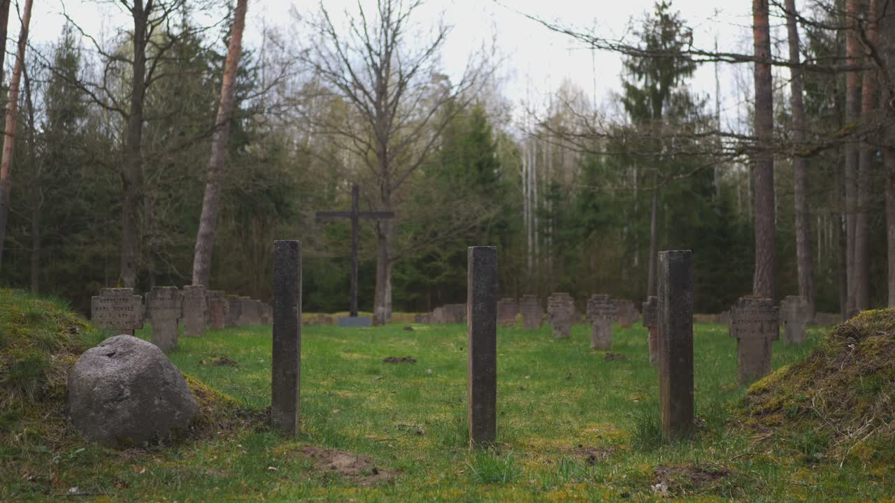 Entrance to an old wartime cemetery in the woods