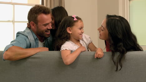 Happy-family-playing-on-the-sofa