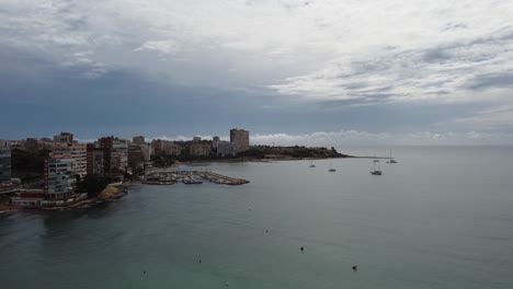 coastal cityscape under cloudy skies