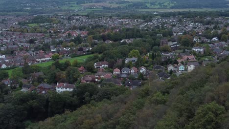 Aerial-view-above-Halton-North-England-coastal-countryside-town-estate-green-space-rural-houses-zoom-in-right-dolly